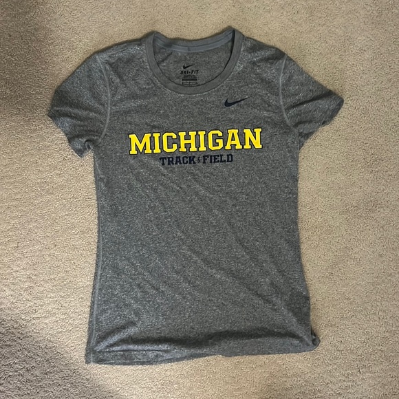 Tops - Nike dri fit University of Michigan track shirt